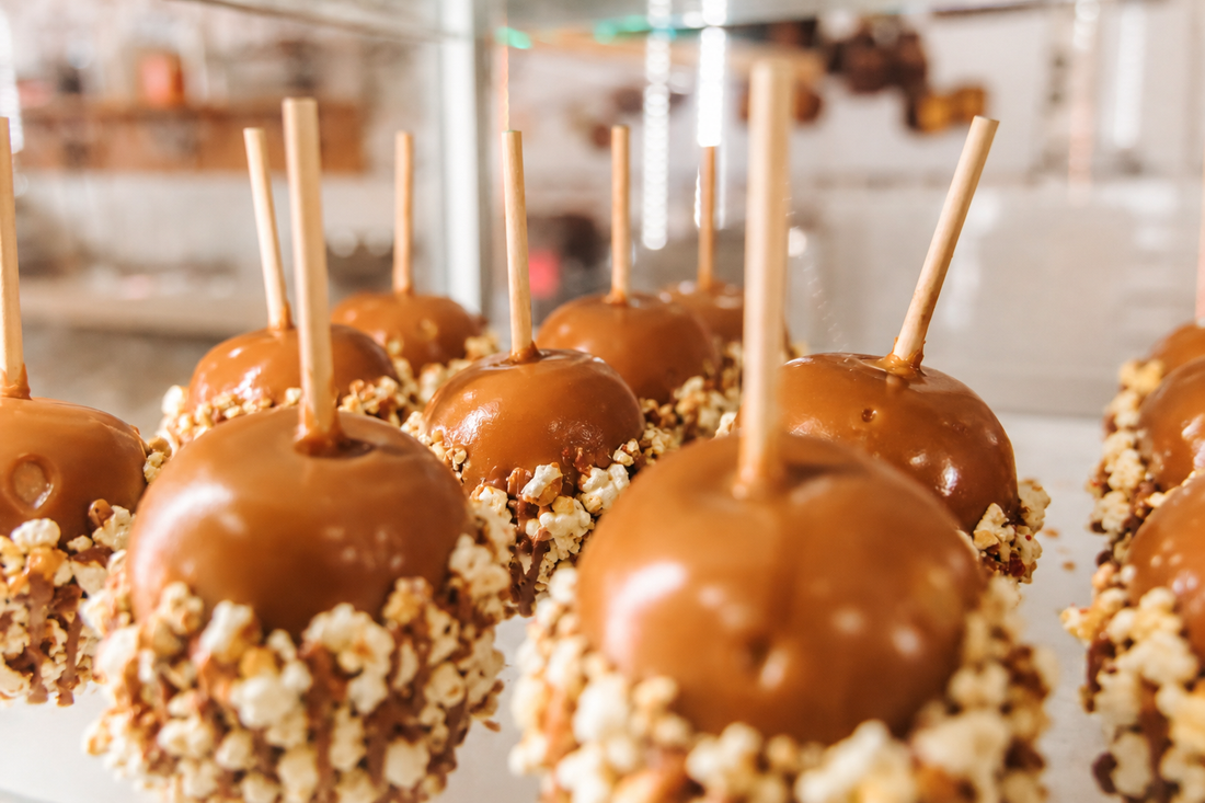 caramel dipped apples with crushed popcorn
