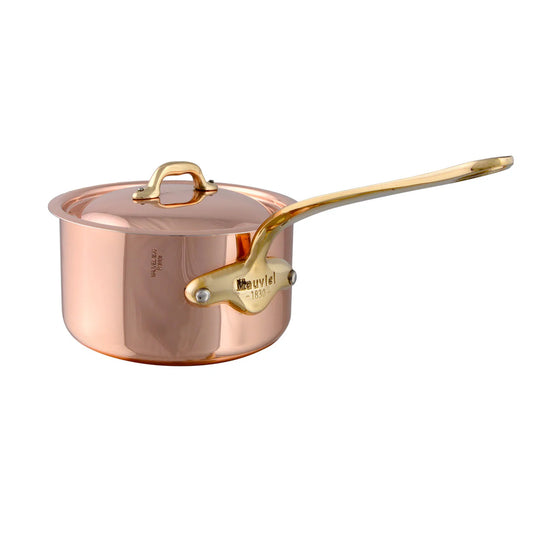 A copper saucepan with a lid and brass handle, polished outside and stainless steel inside.