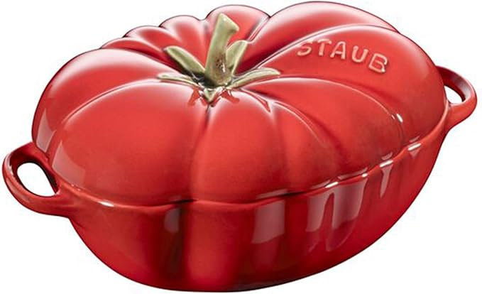 Red Staub tomato-shaped cocotte on a white background