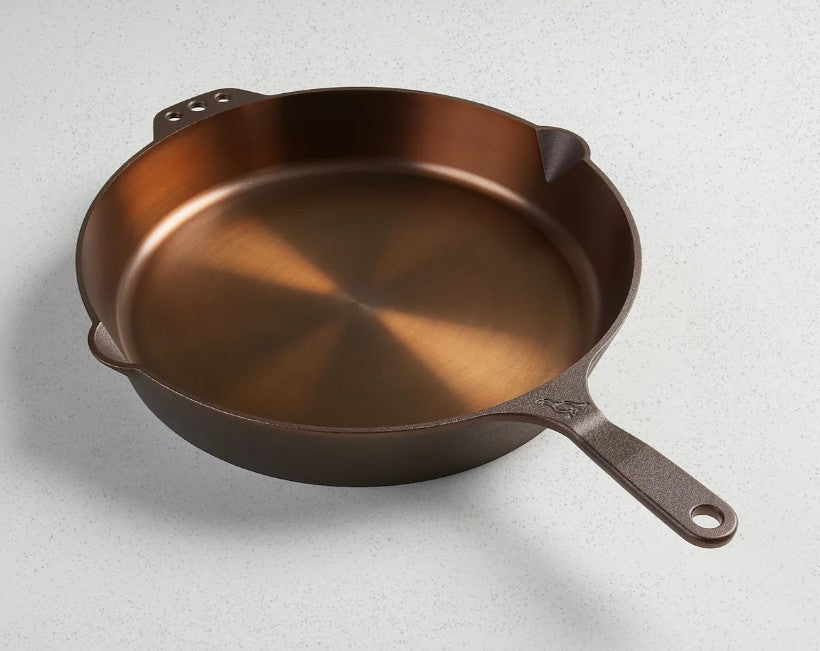 Smithey heirloom quality Cast iron skillet on a light gray background